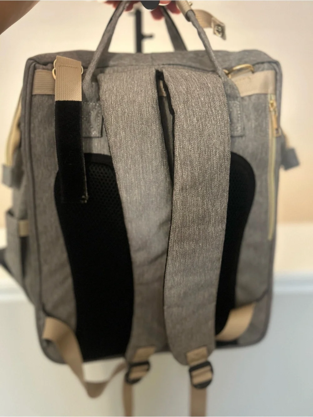 Happy Luoka 3-in-1 diaper bag backpack with built in travel crib & changing pad.